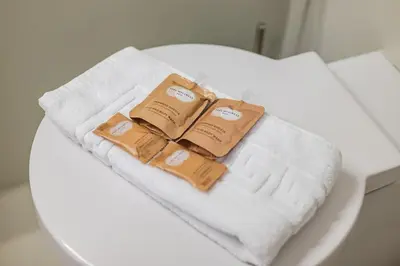 two towels are sitting on top of a toilet at Rome Centre - Spacious Apartment - AC - Wi-Fi - Metro in Rome