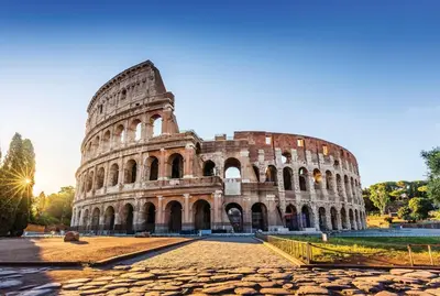 a view of the colosseum at sunset at Rome Centre - Spacious Apartment - AC - Wi-Fi - Metro in Rome