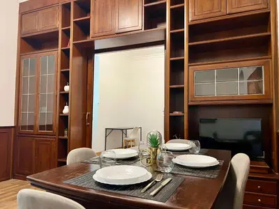 a dining room with a wooden table and chairs at Suite Vaticano in Rome