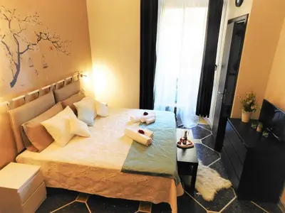 a bedroom with a bed with two towels on it at Guest house Aria in Rome
