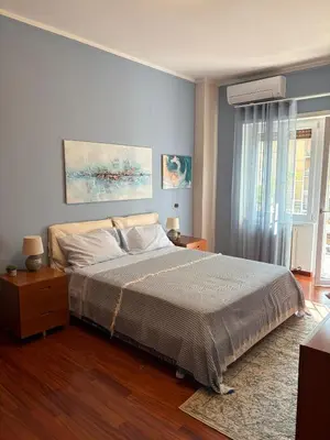 a bedroom with a large bed and a window at San Pietro Street 9 in Rome