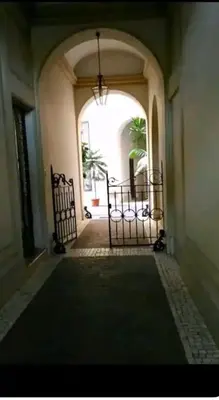 an empty hallway with a gate in a building at La casetta di Brigida in Rome