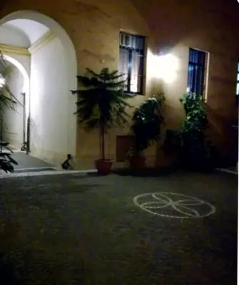 a building with a bike painted on the ground at La casetta di Brigida in Rome