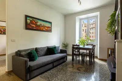 a living room with a couch and a table at La Casa di Edo in Rome