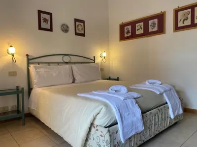 a bedroom with a bed with towels on it at casa vacanze Borgo San Lazzaro in Rome