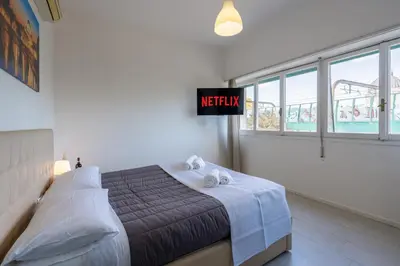 a bedroom with a bed and a sign that reads methinking at NEW OPENING! Close to St Peter & Free Netflix in Rome