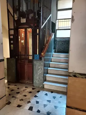an entrance to a building with stairs and a door at Blue House Termini-Colosseo in Rome