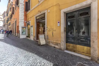 a building with a door on the side of a street at Pantheon Authentic and Modern Apartment in Rome