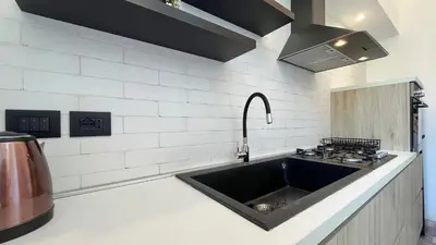 a kitchen with a sink and a stove at Casa Daria in Rome