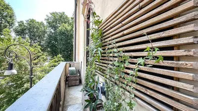 a wooden fence with plants on the side of a building at Casa Daria in Rome