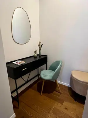 a room with a desk and a chair and a mirror at Archouse - Elegant apartment a 10 min dal Colosseo in Rome