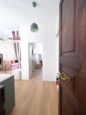 a room with a door and a living room at Vatican Apartment Borgo Pio 160 by MSuite in Rome