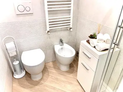 a small bathroom with a toilet and a sink at Appartamento metro Ponte Lungo in Rome