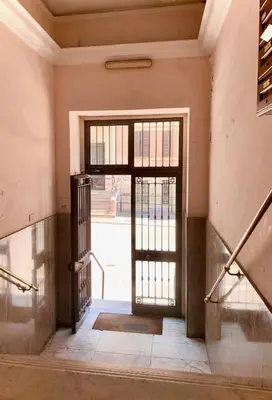 an open door in an empty room with a staircase at Appartamento metro Ponte Lungo in Rome