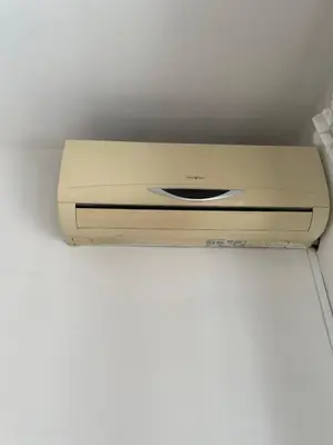 a dvd player sitting on top of a box at Bright and Cozy Studio Apartment near Trastevere Station in Rome