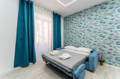 a bedroom with a bed with two stuffed animals on it at Stylish Vatican Stay - WiFi Metro Walk Everywhere in Rome