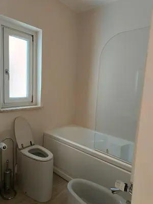 a bathroom with a tub and a toilet and a sink at Via del Corso Apartment in Rome