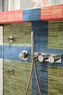 a shower in a bathroom with colorful tiles at NEW 3BDR Lab4House a Villa Borghese Roma Parioli in Rome