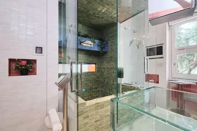 a glass shower stall in a bathroom with a window at NEW 3BDR Lab4House a Villa Borghese Roma Parioli in Rome