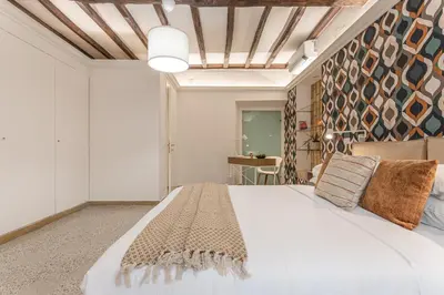 a bedroom with a large white bed in a room at Key Apartment Trastevere in Rome