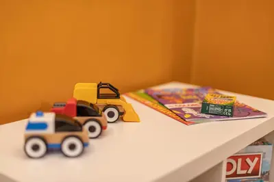 a toy truck and a toy car on a table at Key Apartment Trastevere in Rome