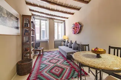 a living room with a couch and a table at Flaminia Luxury Hideaway in Rome