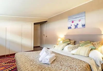 a bedroom with a large bed in a room at Flaminia Luxury Hideaway in Rome