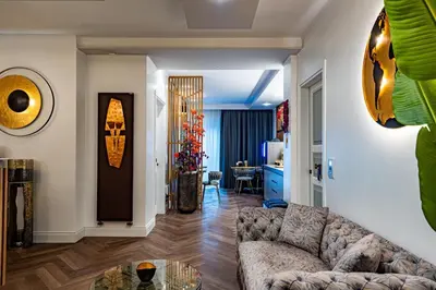 a living room with a couch and a table at SOFIA Ultra Suite Collection in Rome