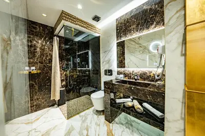 a bathroom with a shower and a toilet and a sink at SOFIA Ultra Suite Collection in Rome