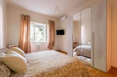 a bedroom with a bed and a large mirror at MaSa Holidays House Vatican in Rome