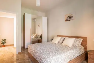 a bedroom with a bed and a mirror at MaSa Holidays House Vatican in Rome