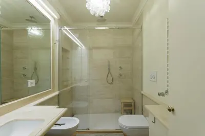 a bathroom with a shower and a toilet and a sink at Sant'Angelo Apartment in Rome