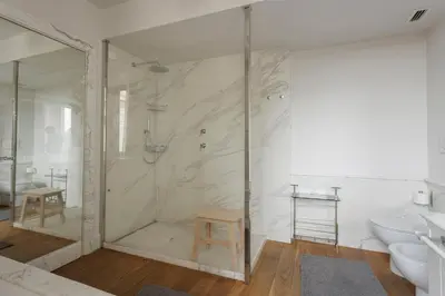 a bathroom with a shower and a toilet and a sink at Sant'Angelo Apartment in Rome