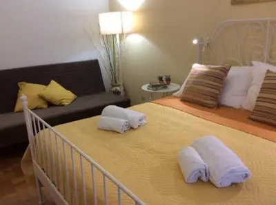 a bedroom with a bed with two pillows on it at Big Home In Vatican in Rome