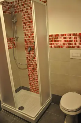 a bathroom with a shower with a toilet at Big Home In Vatican in Rome