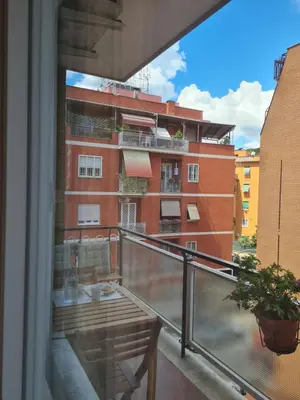 a balcony with a view of a building at Armonia Mediterranea Apartments in Rome