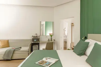 a living room with a bed and a couch at St Peter Museum in Rome