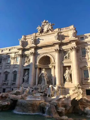 a building with a fountain in front of it at Three bedroom apartment with a view in Monti in Rome
