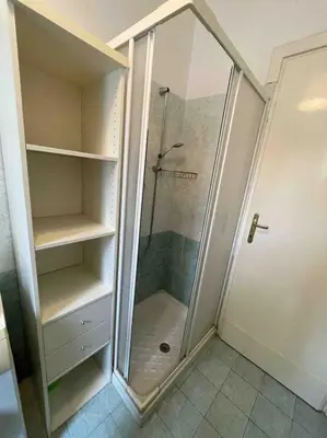 a shower with a glass door in a bathroom at Three bedroom apartment with a view in Monti in Rome