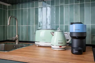 a coffee maker and a toaster on a kitchen counter at Vatican Cozy Studio in Rome