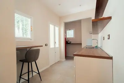 a kitchen with a counter and a stool in a room at Casa mia Navona Rooms in Rome