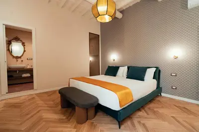 a bedroom with a large bed and a bathroom at Casa mia Navona Rooms in Rome