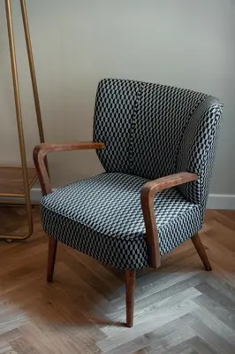 a chair sitting on top of a wooden floor at Casa mia Navona Rooms in Rome