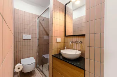 a bathroom with a sink and a toilet at Chigi Home in Rome