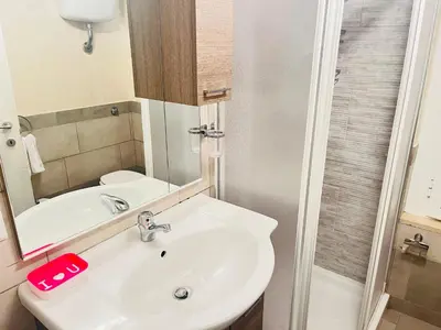 a kitchen with a sink and a stove at Sky Global Suites in Rome