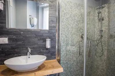 a bathroom with a sink and a shower at Royal House Vaticano in Rome