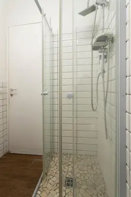 a shower with a glass door in a bathroom at Santa Maria Maggiore & Colosseo - Domus Aurea by Hôtea in Rome