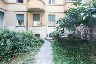 an apartment building with a path in front of it at Santa Maria Maggiore & Colosseo - Domus Aurea by Hôtea in Rome