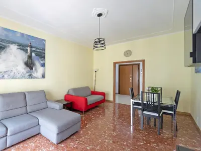a living room with a couch and a table at Welcome to Pigneto in Rome