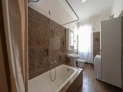 a bathroom with a tub and a toilet and a sink at Welcome to Pigneto in Rome